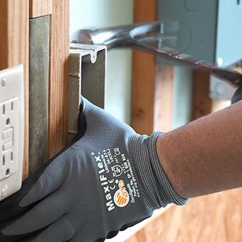 McElroy Electric electrician adds a new power outlet in an unfinished room.