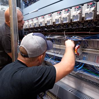 McElroy Electric licensed electricians install, interconnect, trouble-shoot and service manufacturing process controls and PLCs.