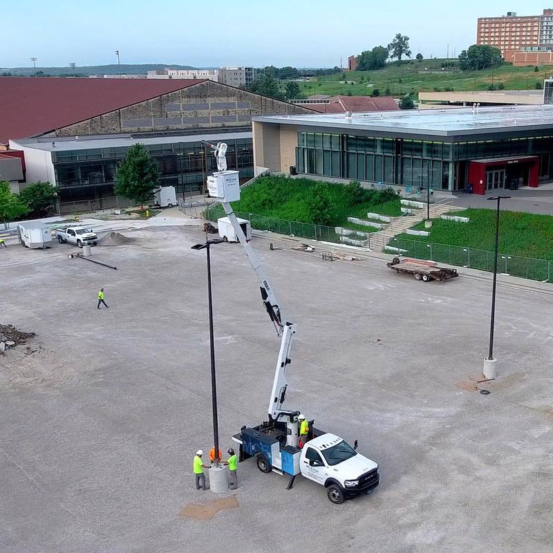 The McElroy Electric bucket truck makes a parking lot lighting upgrade near Allen Fieldhouse fast and simple.