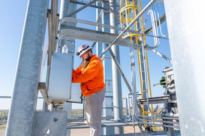A McElroy Electric electrician works on the electrical system for a large scale grain processing facility.
