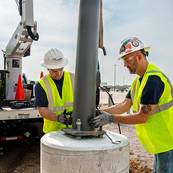 McElroy Electric team secures a new light pole on its base.